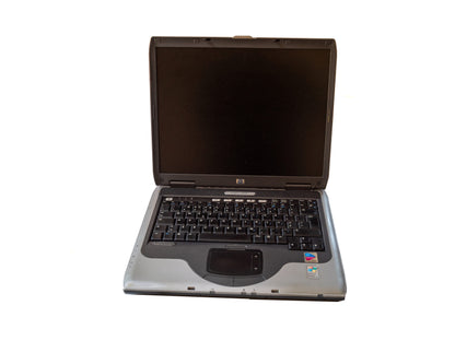 HP NX9030 Notebook, Pentium M 1.7 GHz, 480 MB RAM, 60 GB HDD, with charger and battery.